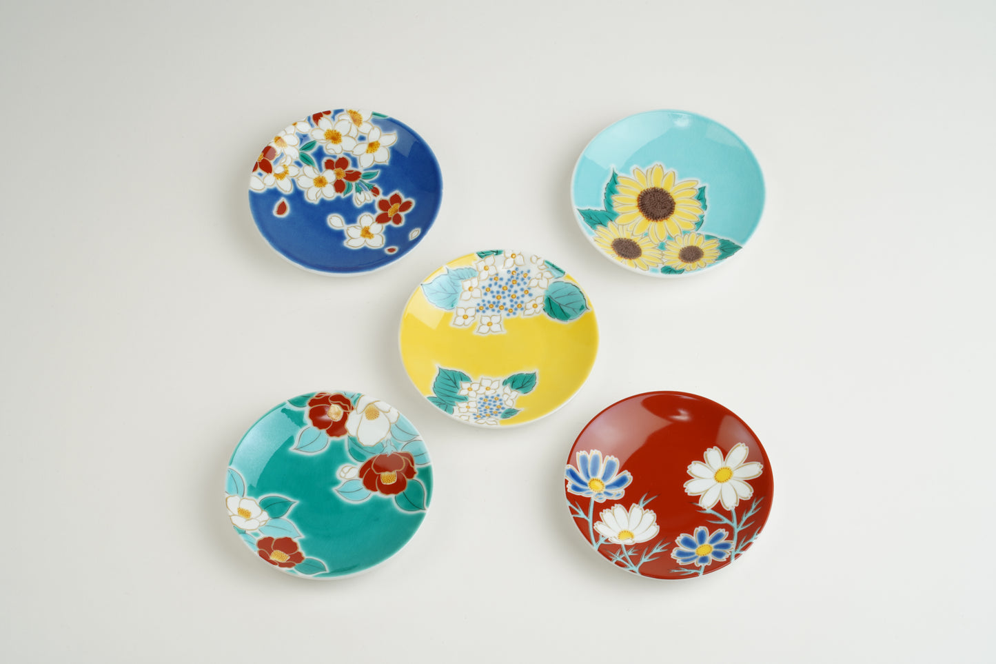 Set of small plates with seasonal flowers