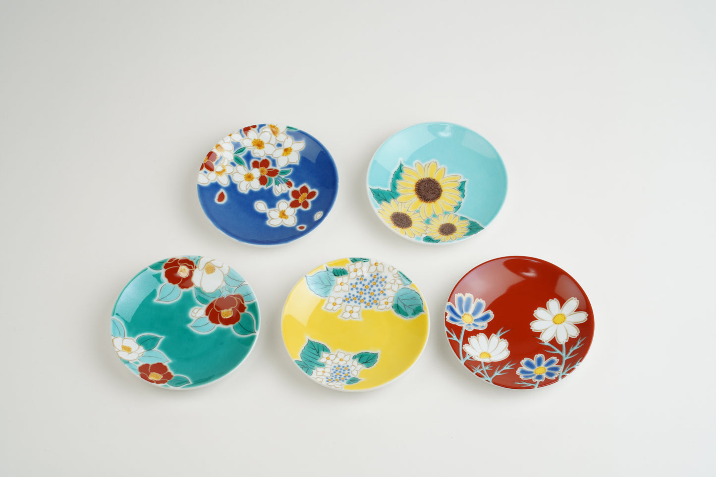 Set of small plates with seasonal flowers