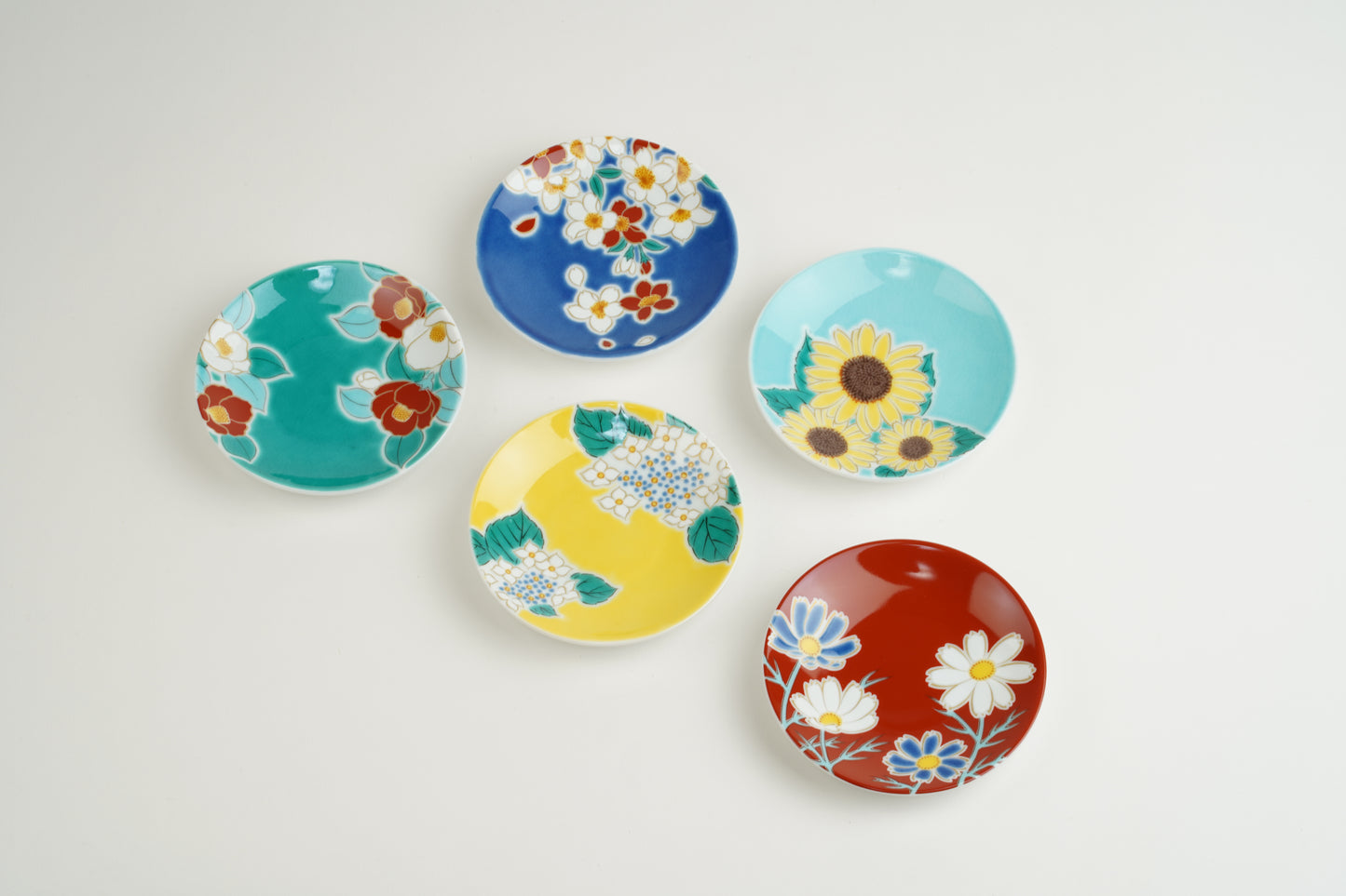 Set of small plates with seasonal flowers